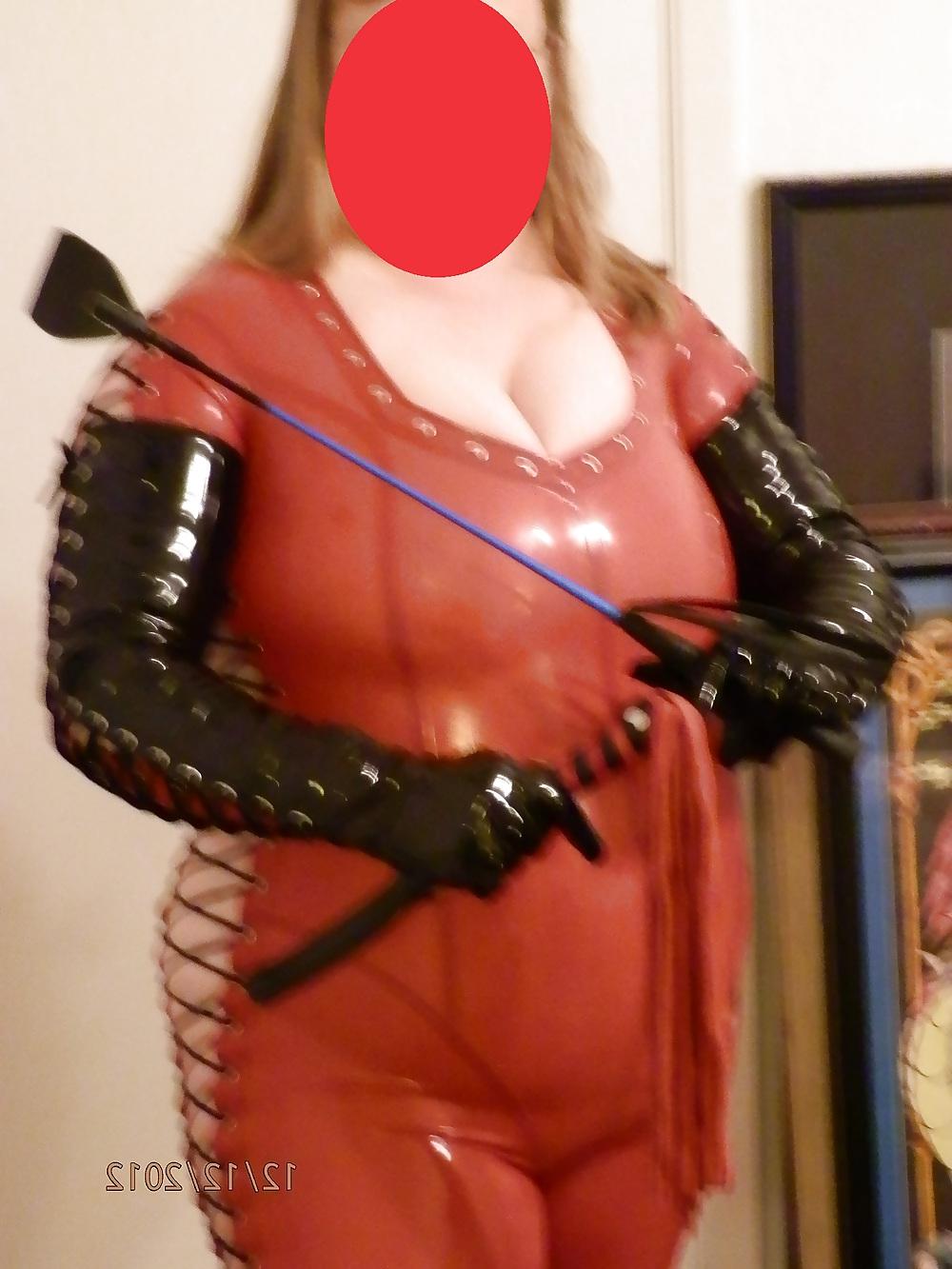 25P Mistress in her red latex catsuit