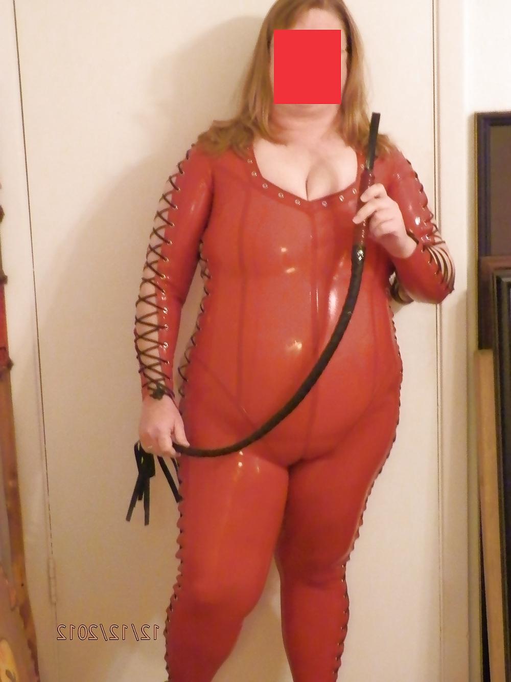 25P Mistress in her red latex catsuit