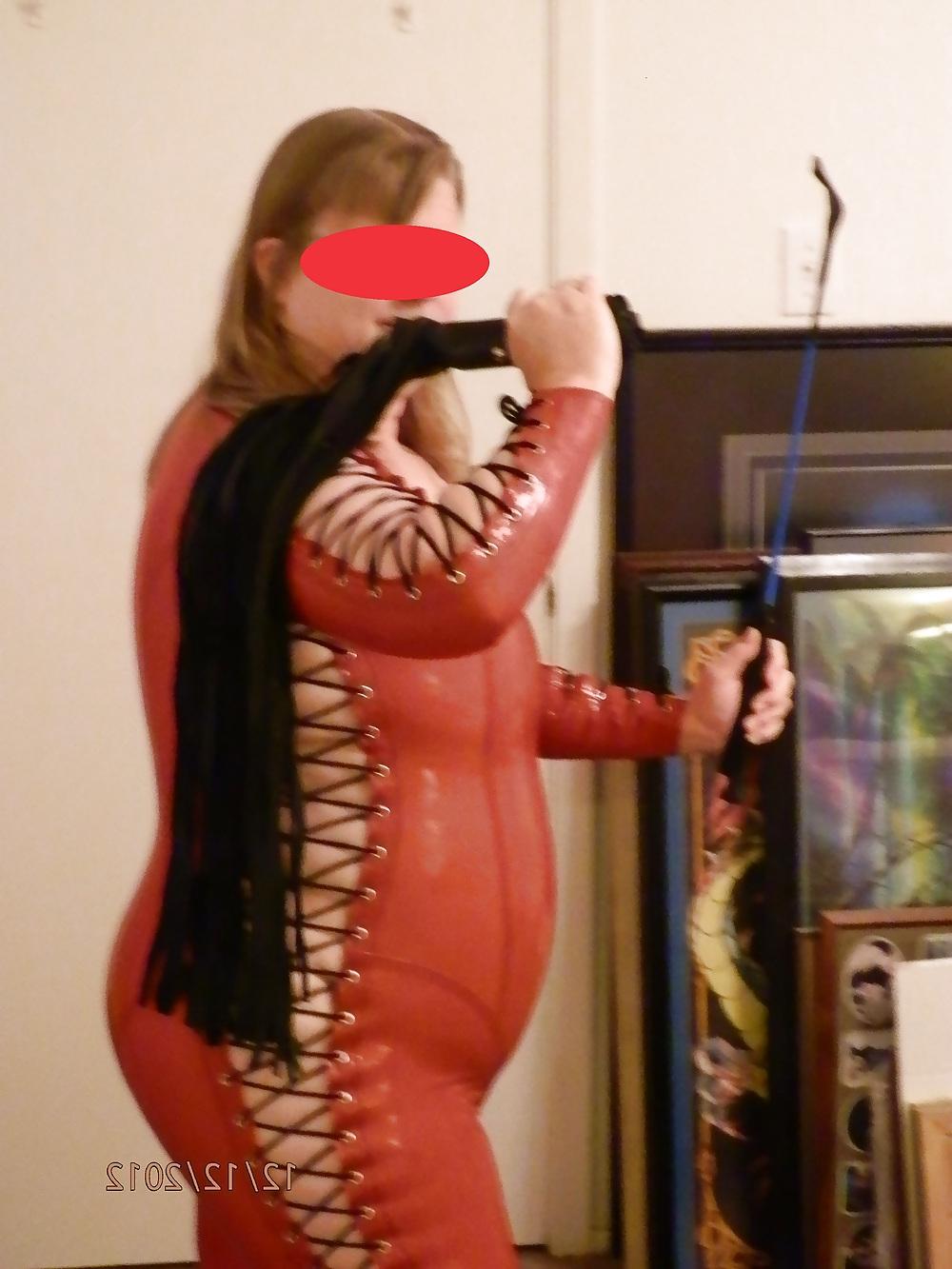 25P Mistress in her red latex catsuit
