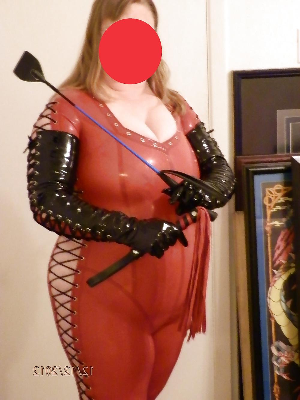 25P Mistress in her red latex catsuit