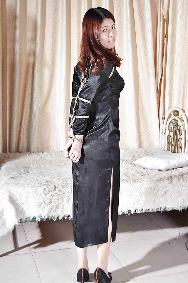 25P Elegant Chinese slaves in bondage