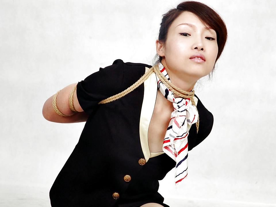 12P Chinese stewardess in bondage
