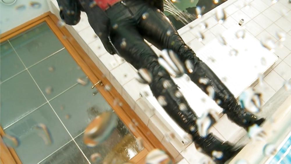 25P Sexy girl in wet leather jacket, pants and boots