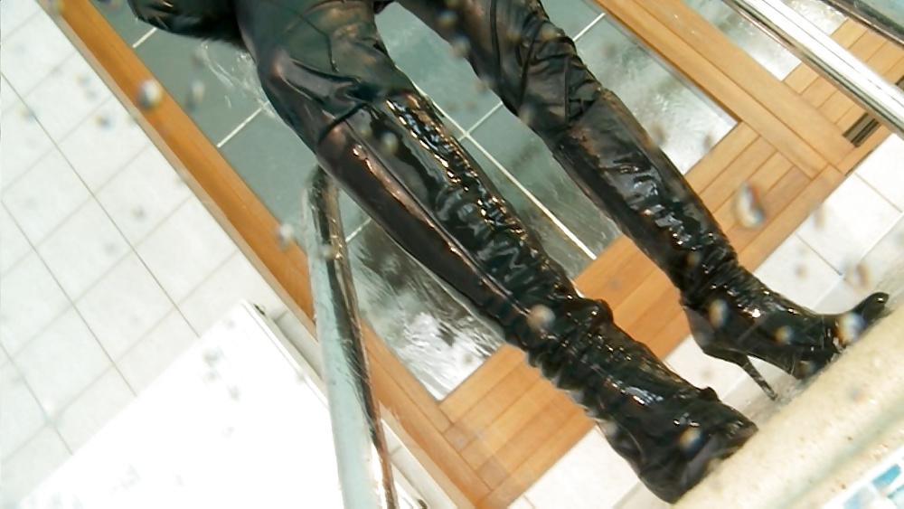 25P Sexy girl in wet leather jacket, pants and boots