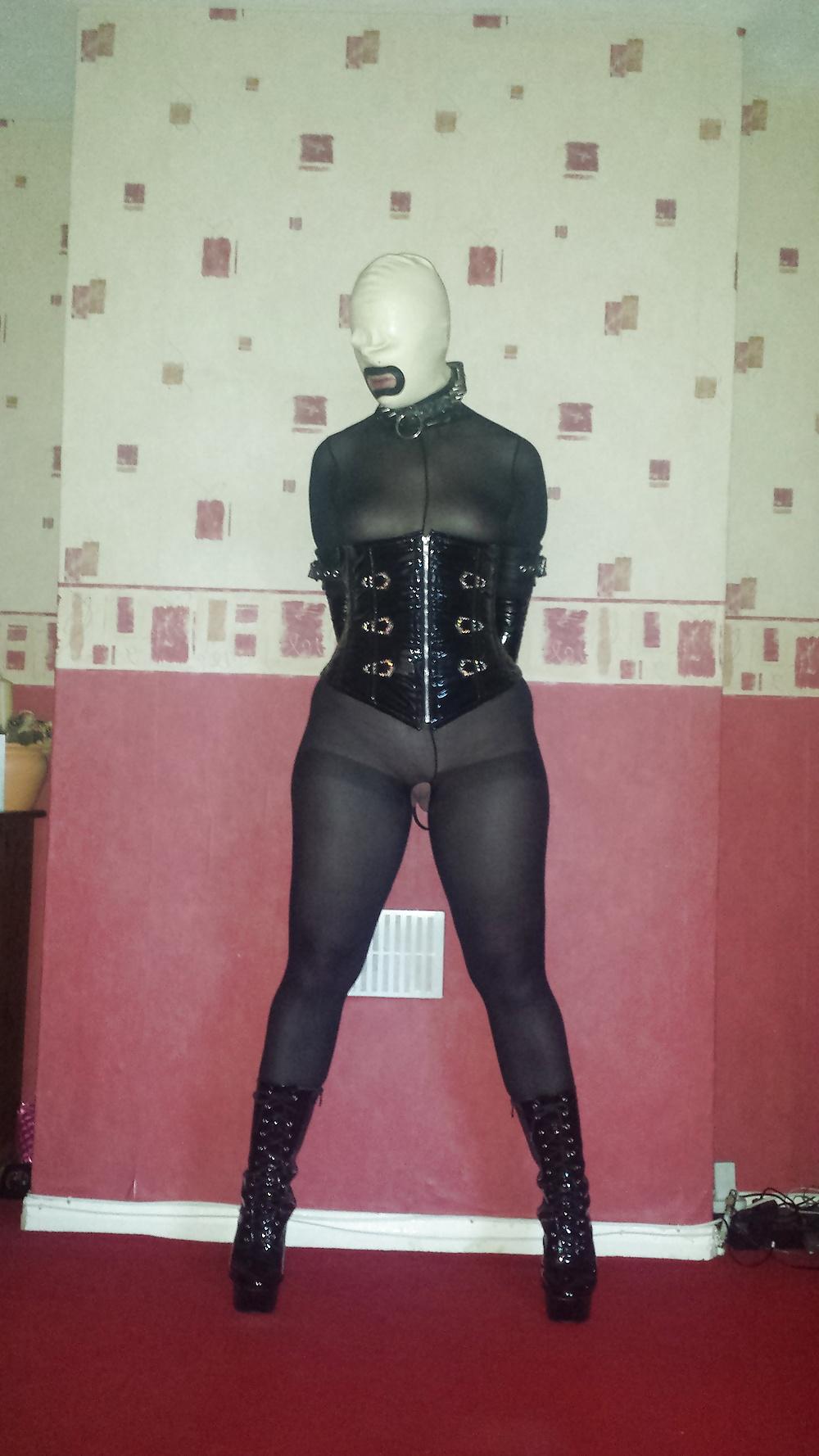 8P Slave girl in white rubber hood and ankle boots