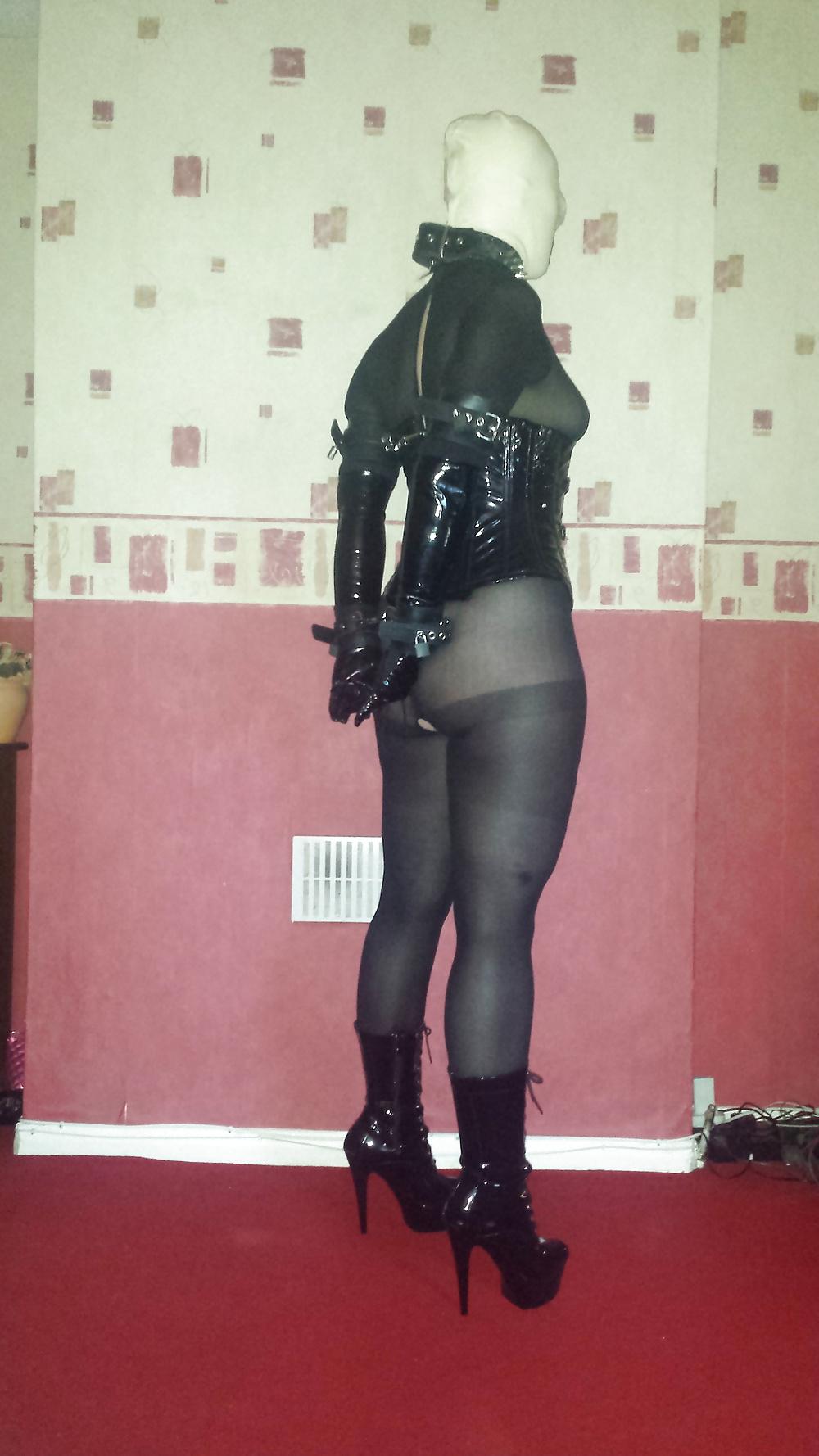 8P Slave girl in white rubber hood and ankle boots