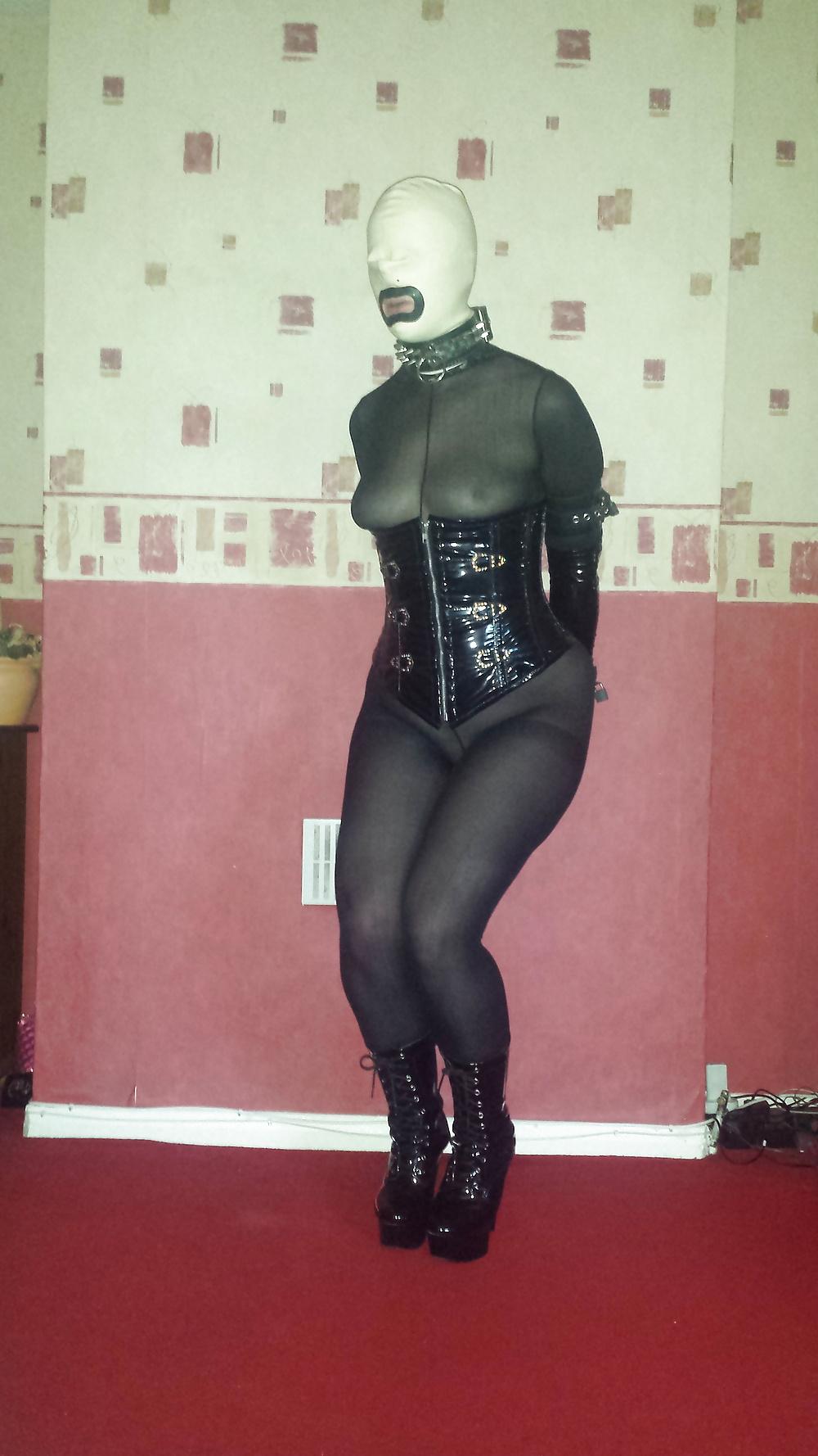 8P Slave girl in white rubber hood and ankle boots