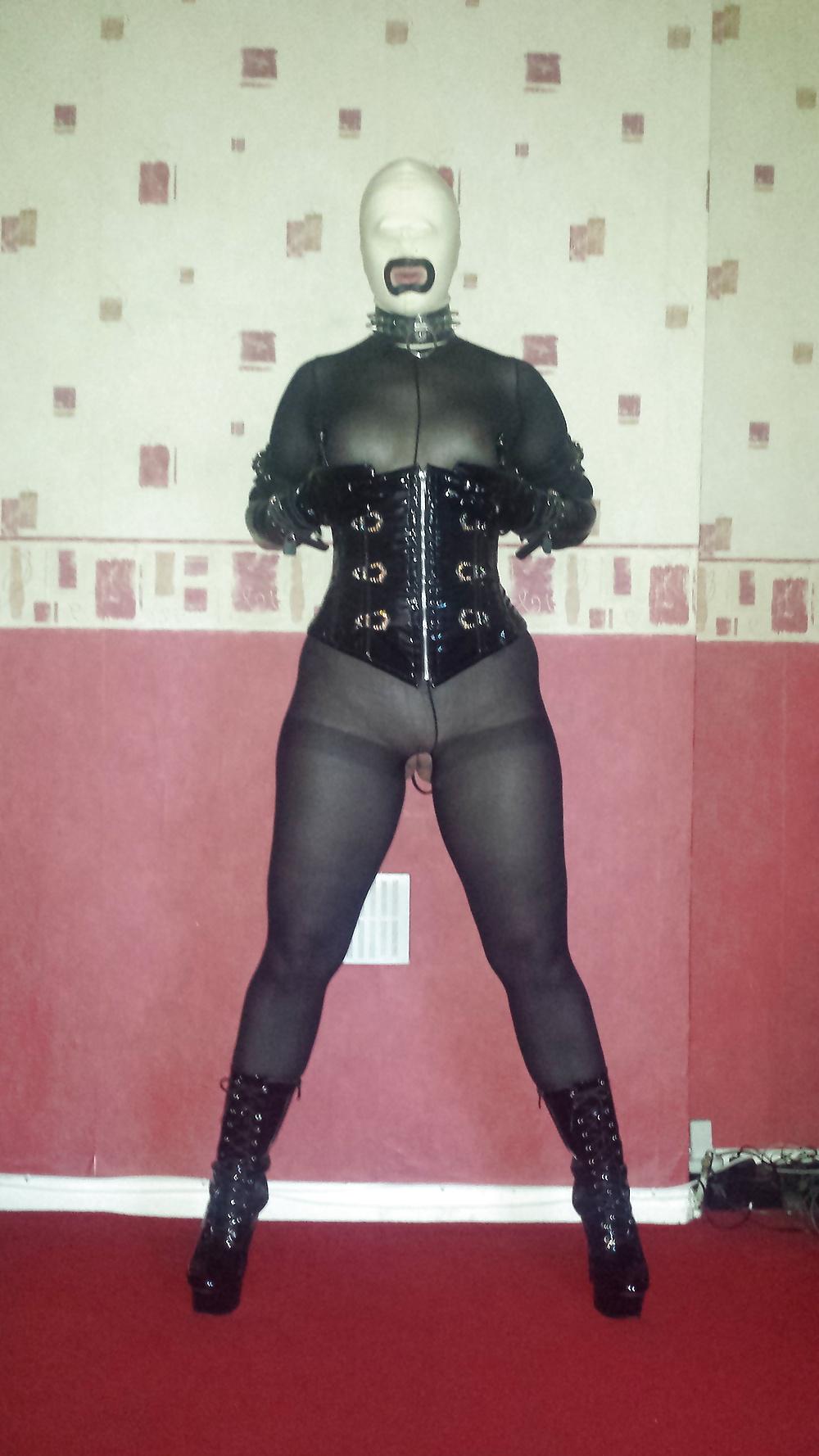 8P Slave girl in white rubber hood and ankle boots