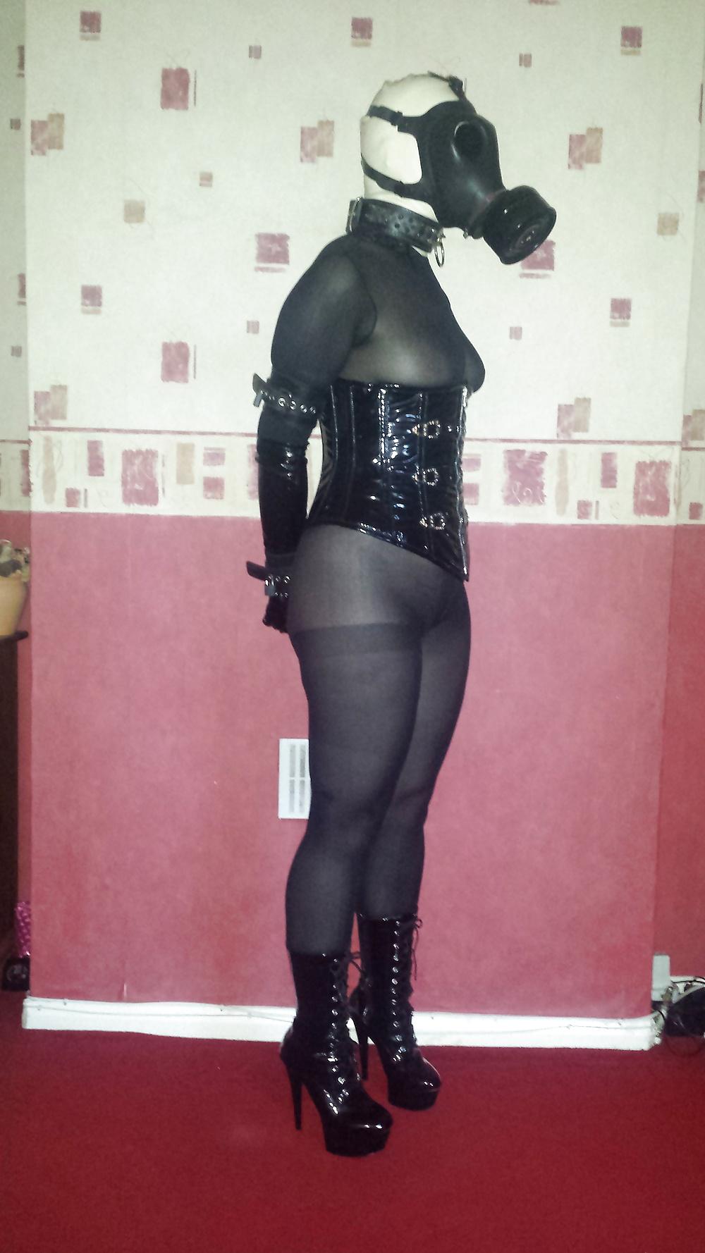 9P Rubber gas mask wearing slave girl in ankle boots