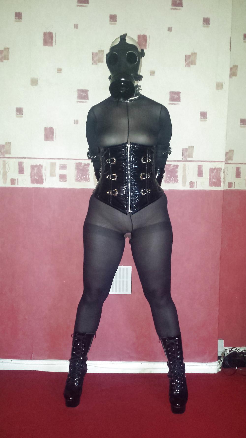 9P Rubber gas mask wearing slave girl in ankle boots