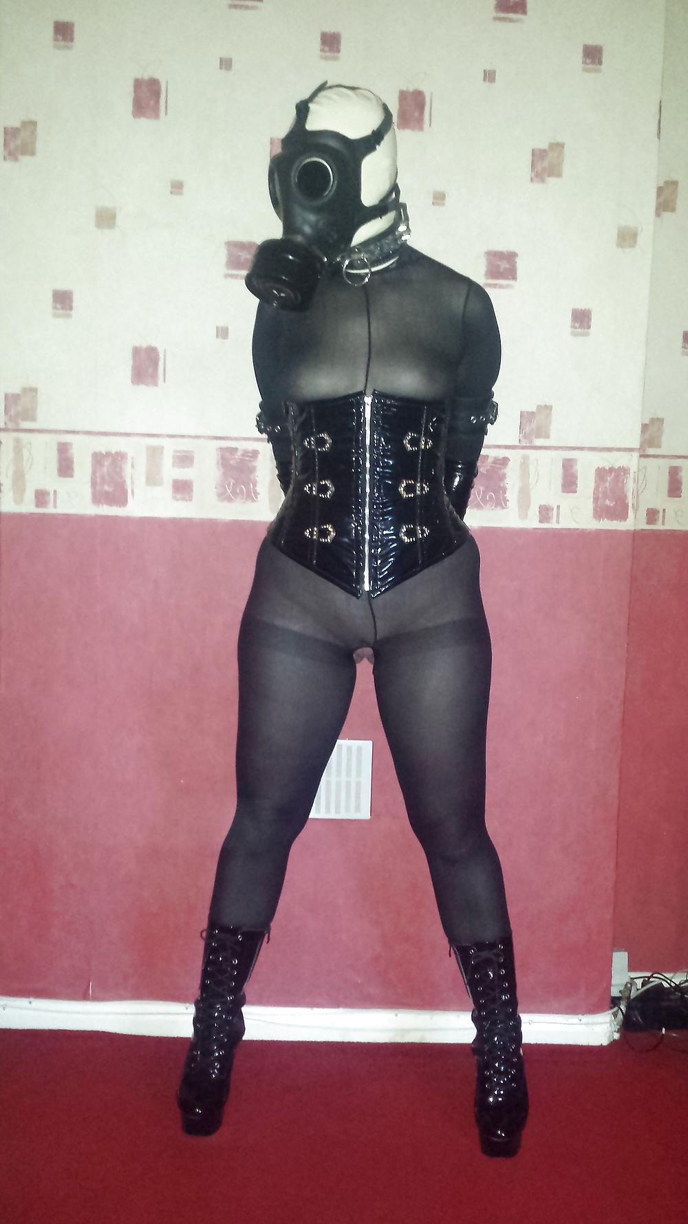 9P Rubber gas mask wearing slave girl in ankle boots
