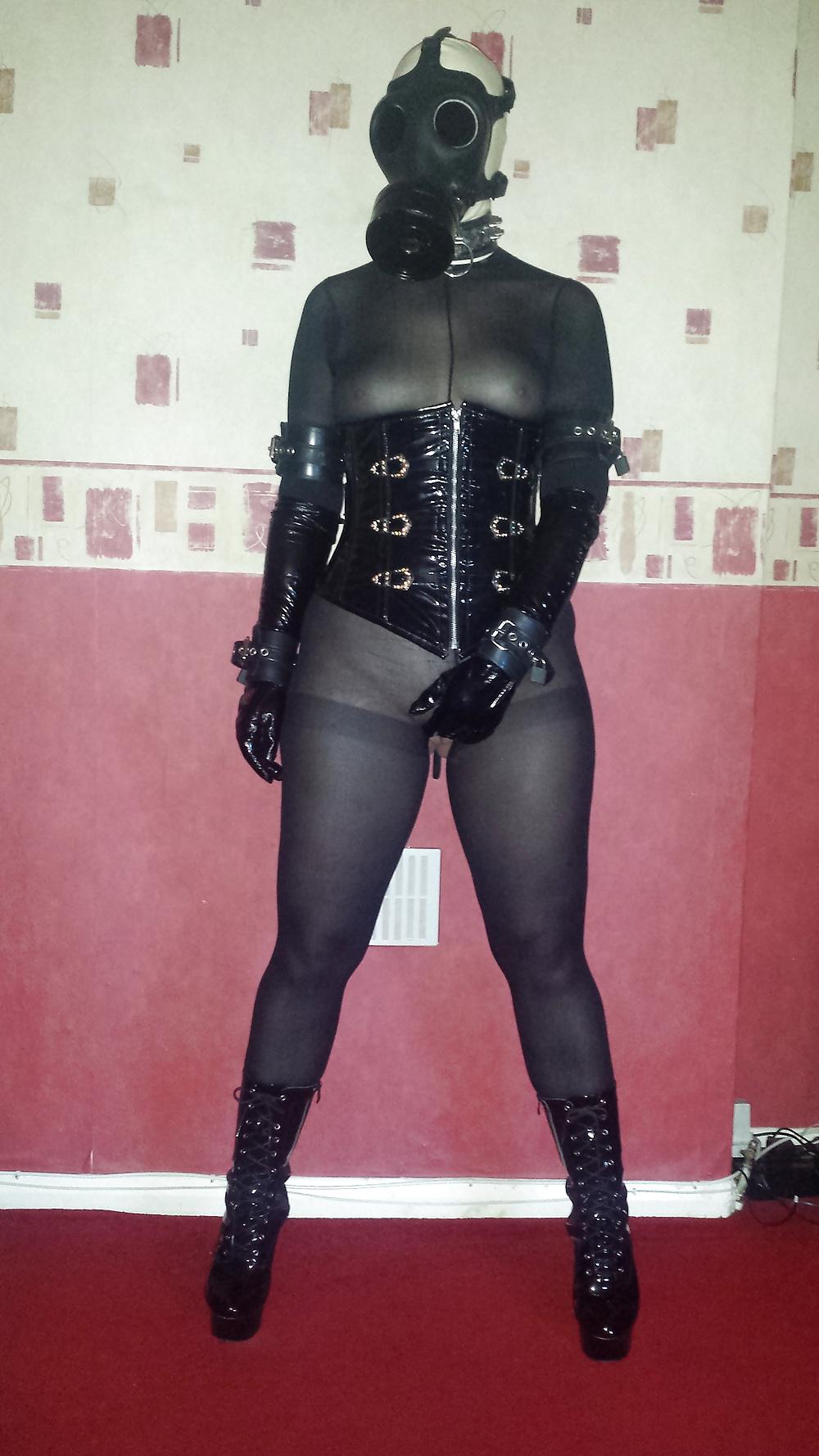 9P Rubber gas mask wearing slave girl in ankle boots