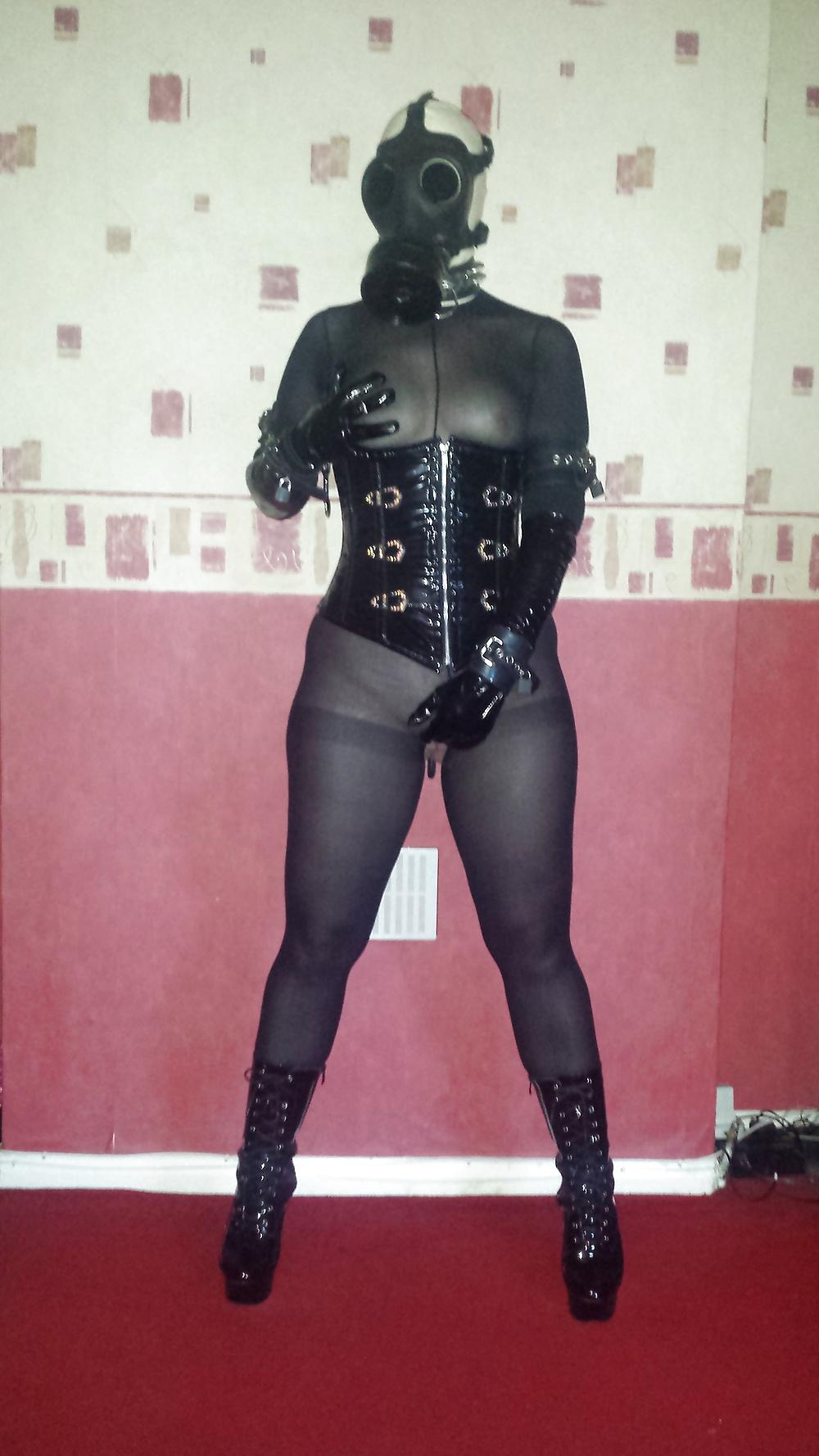 9P Rubber gas mask wearing slave girl in ankle boots