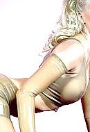 15P Blonde wearing transparent latex catsuit and latex gloves