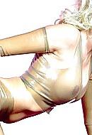 15P Blonde wearing transparent latex catsuit and latex gloves