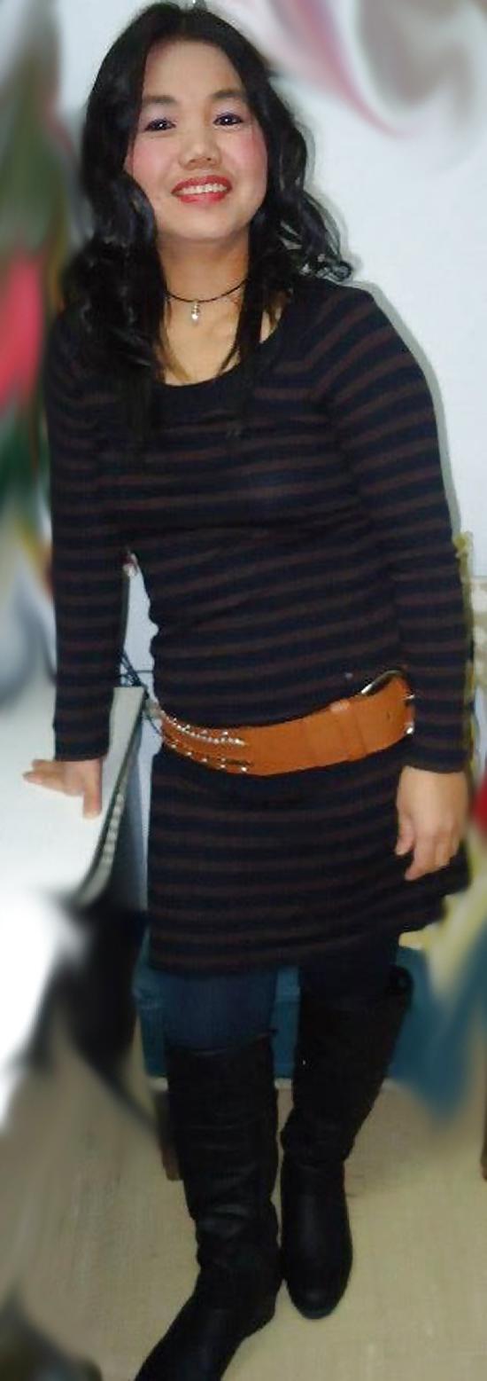 25P S. E. ASIANS  IN  GREEK  STREETS  WEARING  BOOTS