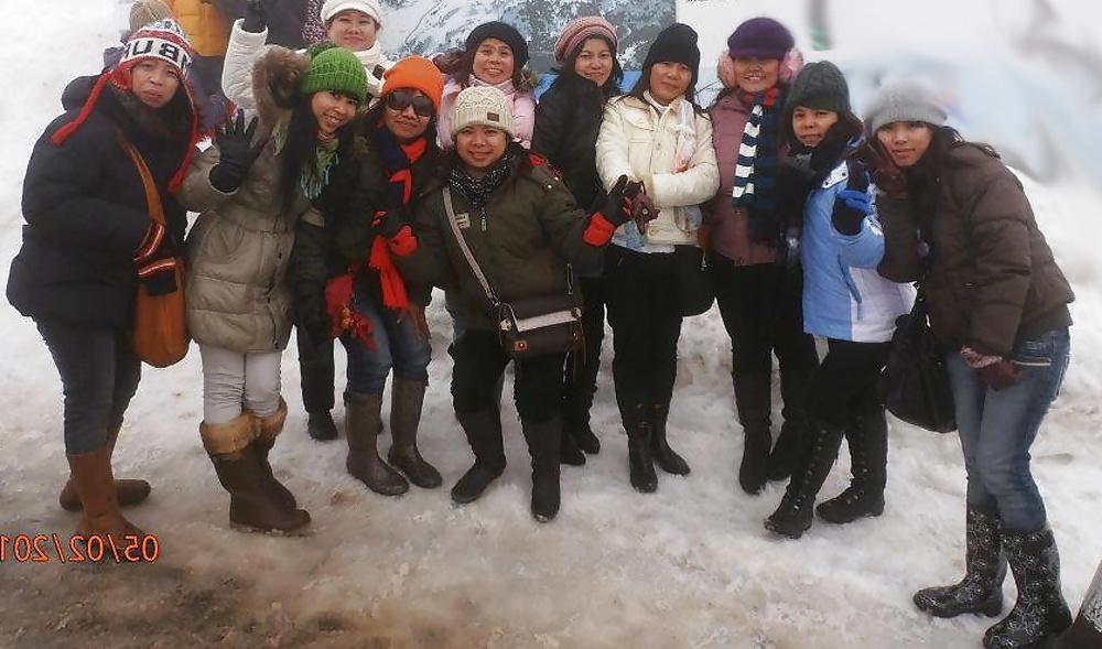 25P S. E. ASIANS  IN  GREEK  STREETS  WEARING  BOOTS