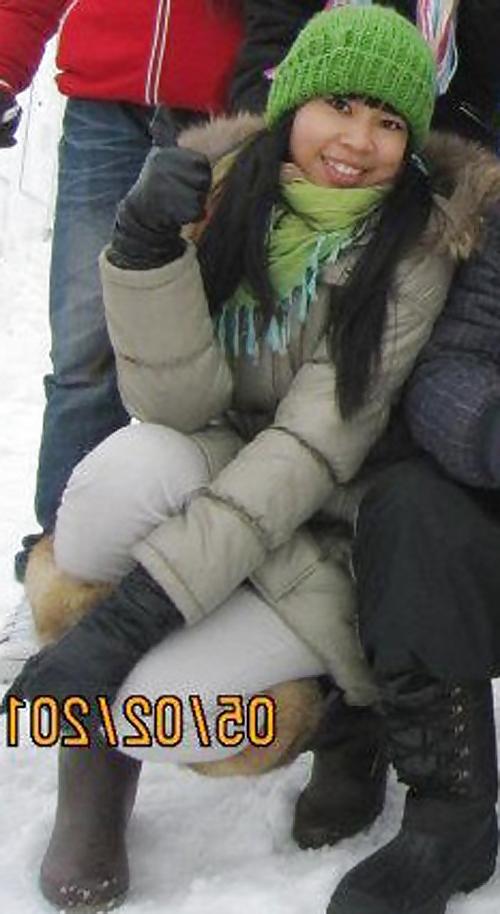 25P S. E. ASIANS  IN  GREEK  STREETS  WEARING  BOOTS
