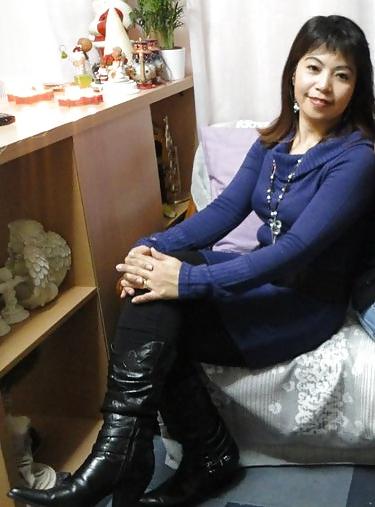 25P S. E. ASIANS  IN  GREEK  STREETS  WEARING  BOOTS