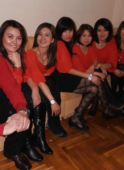 25P S. E. ASIANS  IN  GREEK  STREETS  WEARING  BOOTS