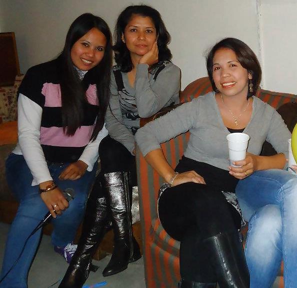 25P S. E. ASIANS  IN  GREEK  STREETS  WEARING  BOOTS