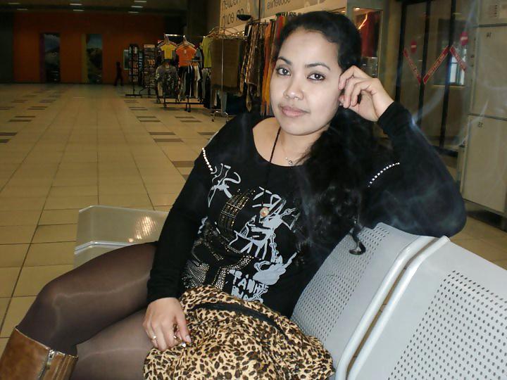 25P S. E. ASIANS  IN  GREEK  STREETS  WEARING  BOOTS