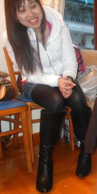 25P S. E. ASIANS  IN  GREEK  STREETS  WEARING  BOOTS