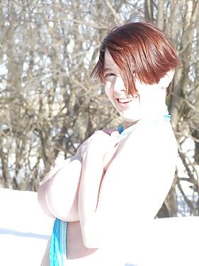 25P Curvy redhead with big ass and tits posing outside