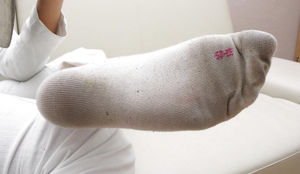 18P Girl shows her worn socks