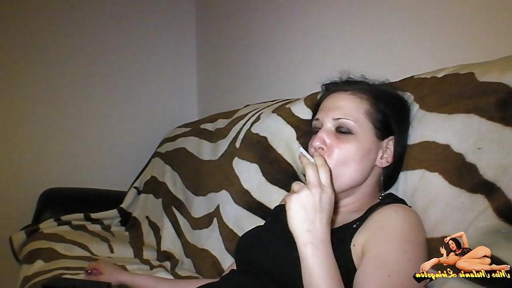 23P Barefeet smoking on sofa