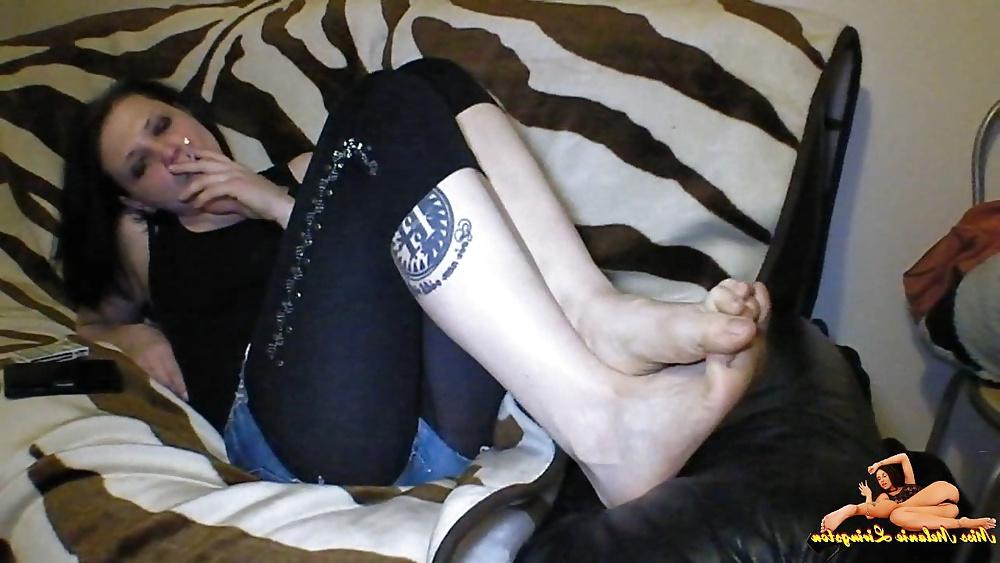 23P Barefeet smoking on sofa