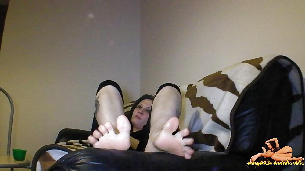 23P Barefeet smoking on sofa