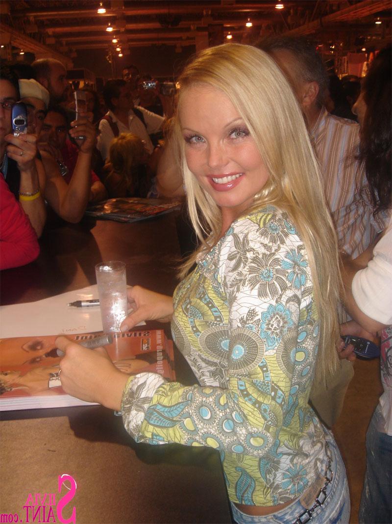 15P Sexy pornstar MILF Silvia Saint posing fully clothed in jeans and boots