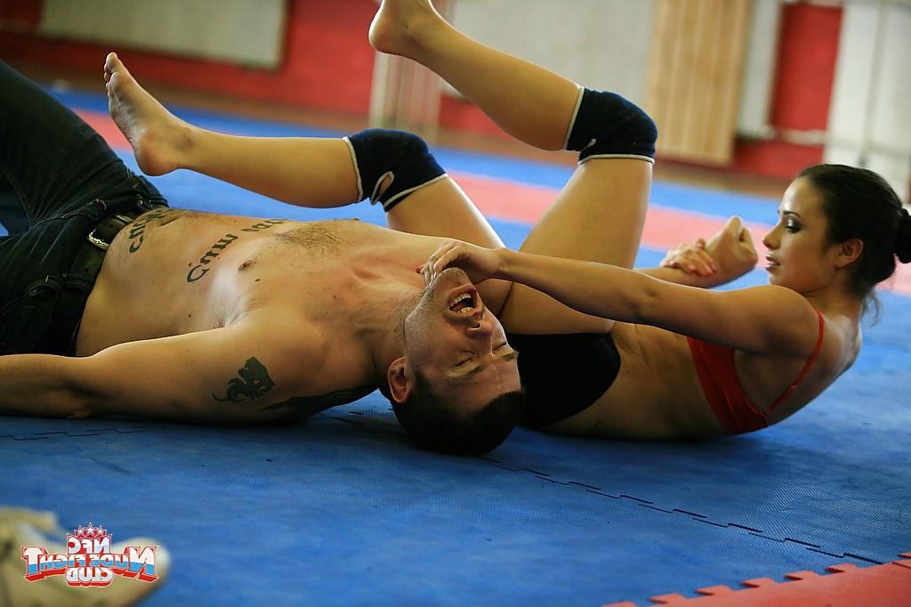 16P Sporty chicks fight on a wrestling floor for a lesbian domination