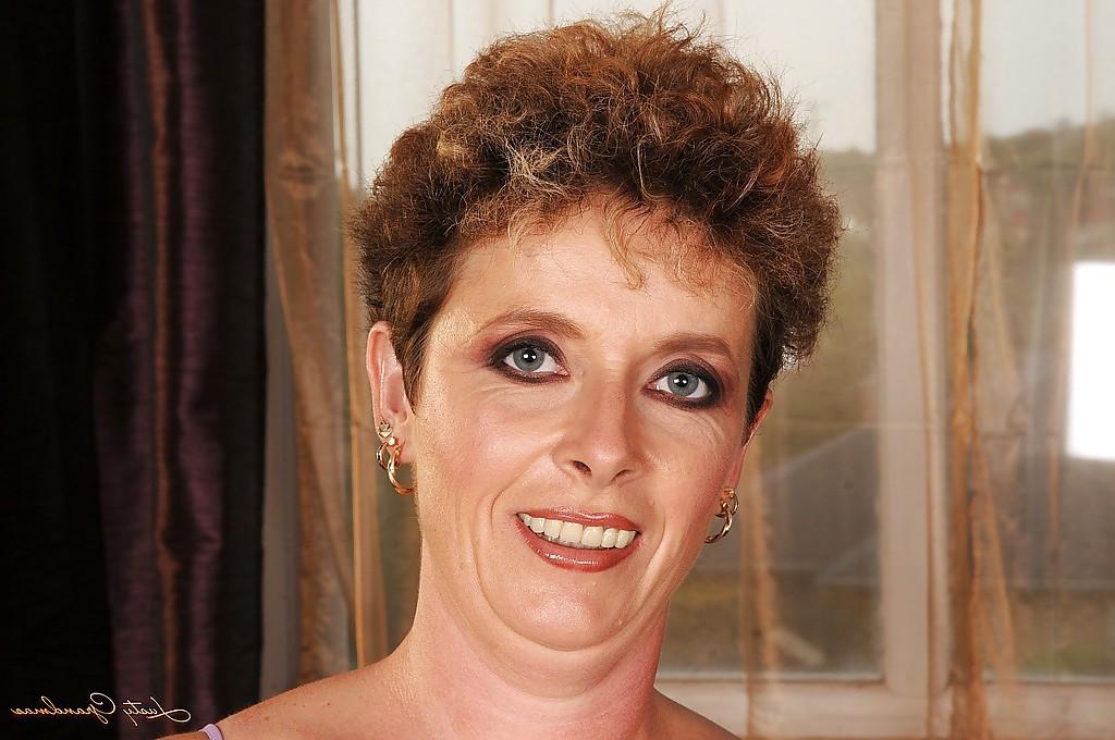 16P Lusty granny with big flabby jugs stripping and spreading her legs