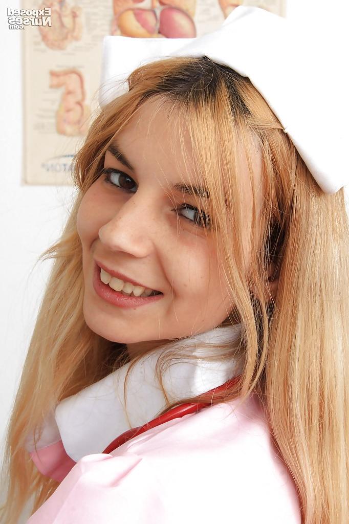 15P Sassy gyno nurse taking off her panties and fingering her pink hole