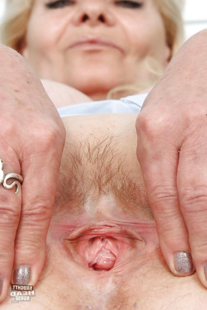 16P Filthy granny in nurse uniform masturbating her twat with toys