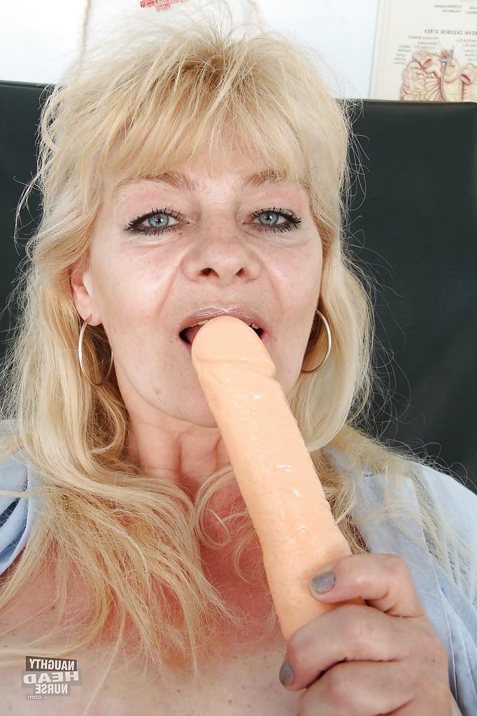 16P Filthy granny in nurse uniform masturbating her twat with toys