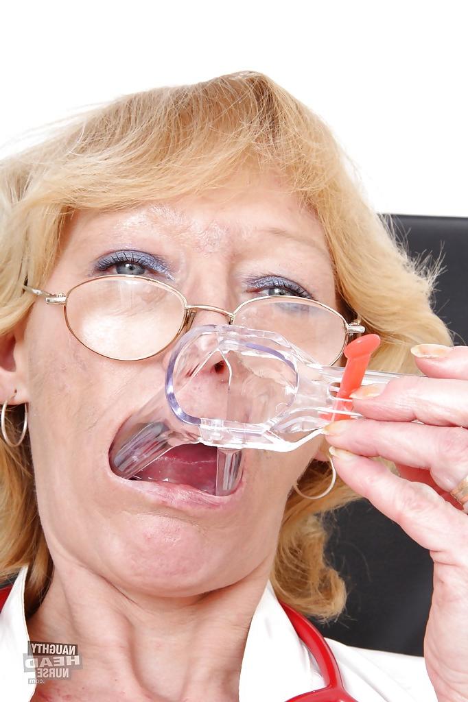 16P Sensuous mature nurse in glasses masturbating her cunt with various toys