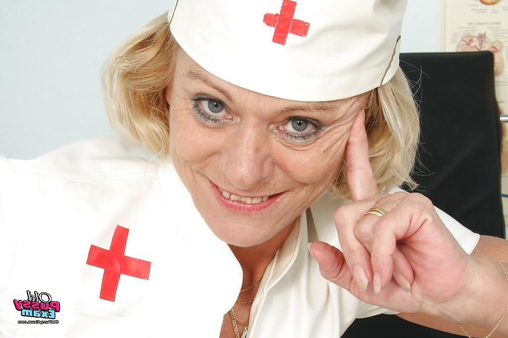 16P Curvaceous granny in nurse uniform masturbating her gloryhole