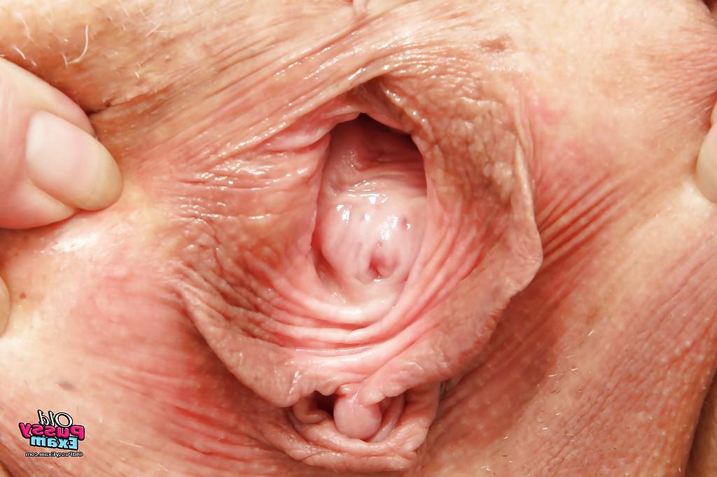 16P Curvaceous granny in nurse uniform masturbating her gloryhole
