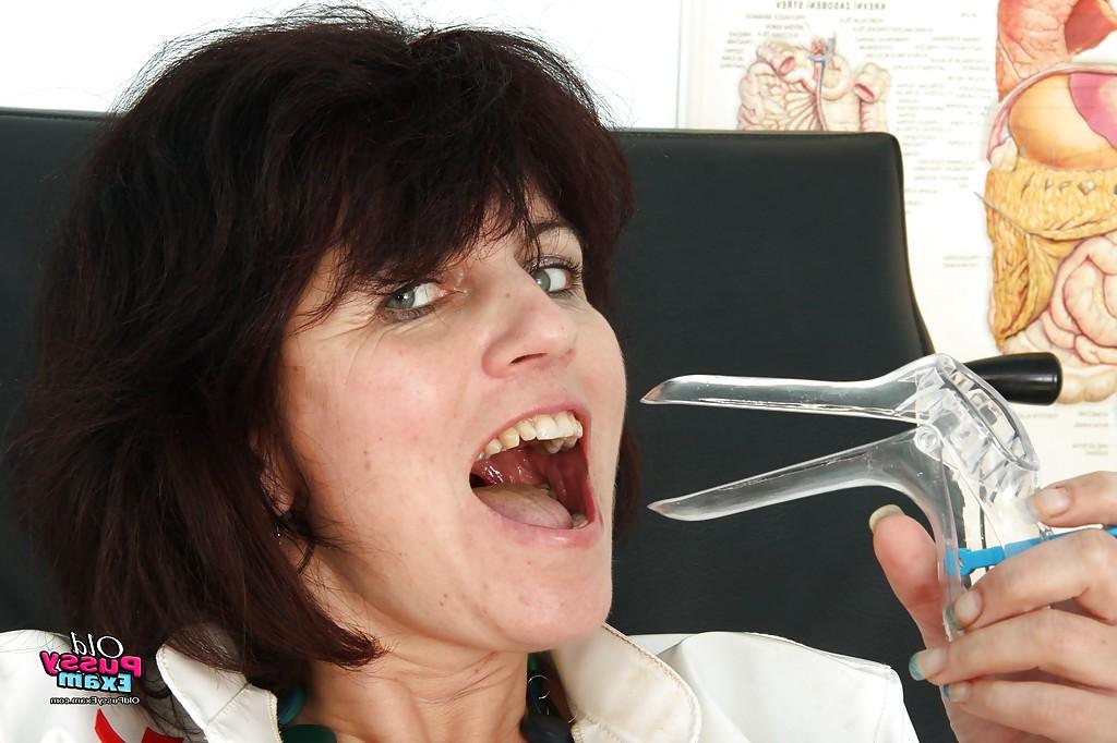 16P Naughty mature gyno nurse masturbating her shaved cunt with a dildo