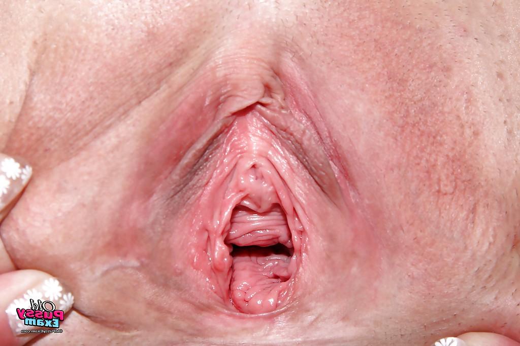16P Horny granny on high heels spreading her legs and masturbating her cunt