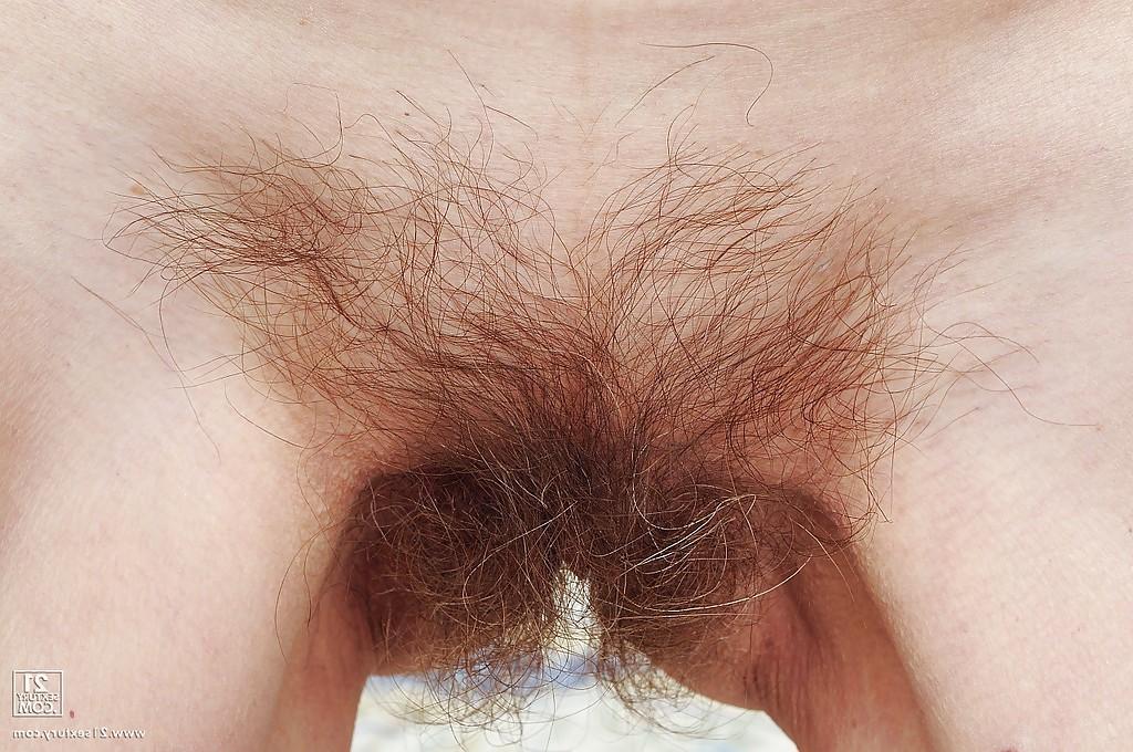 16P Dirty granny Kati Bell with a hairy pussy is masturbating
