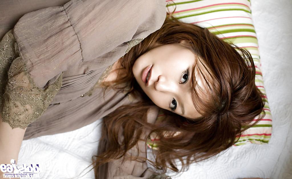 15P Sweet asian babe with perky tits Emi Harukaze slipping off her clothes