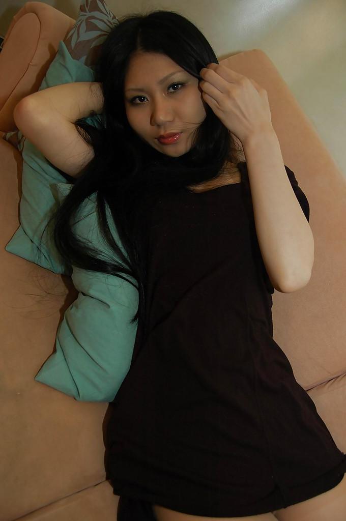 16P Slim asian babe Hitomi Nagase getting naked and spreading her legs