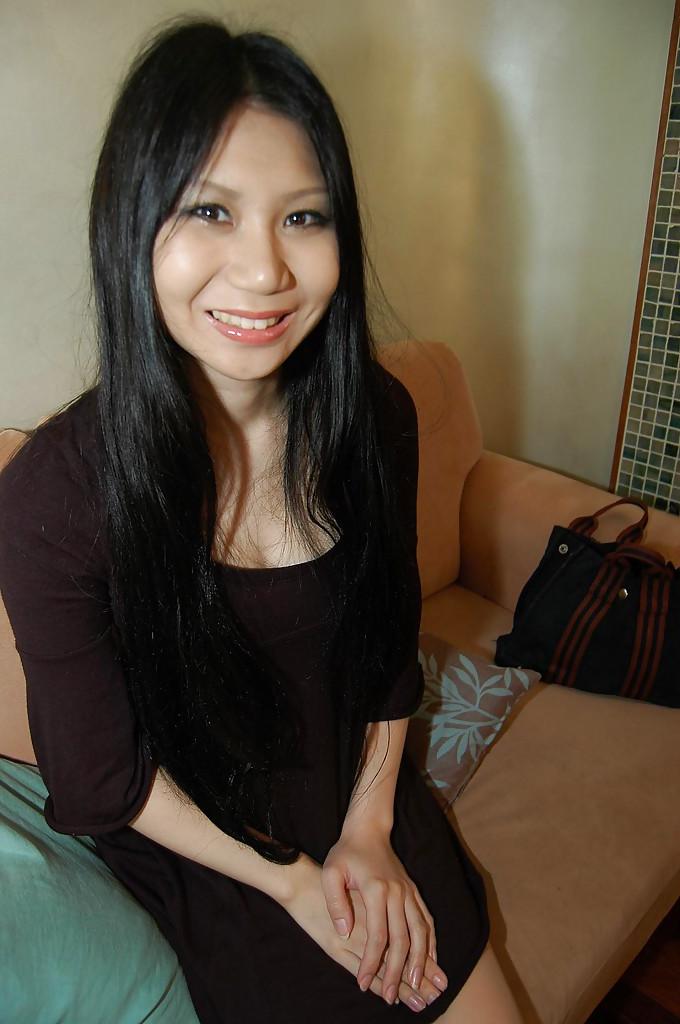 16P Slim asian babe Hitomi Nagase getting naked and spreading her legs