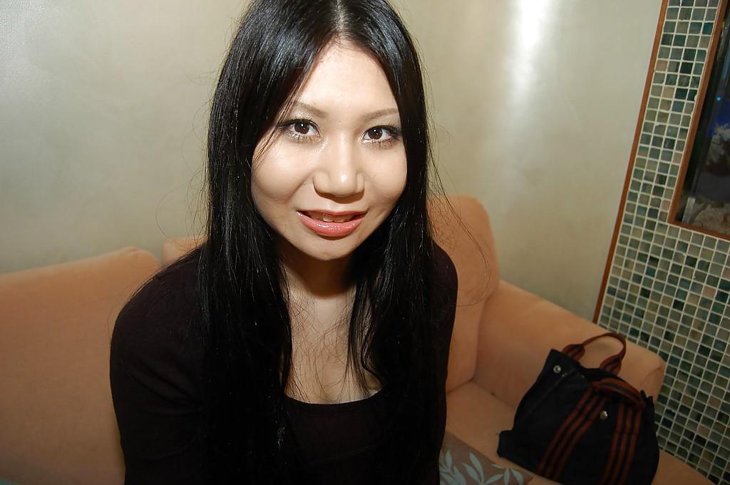 16P Slim asian babe Hitomi Nagase getting naked and spreading her legs