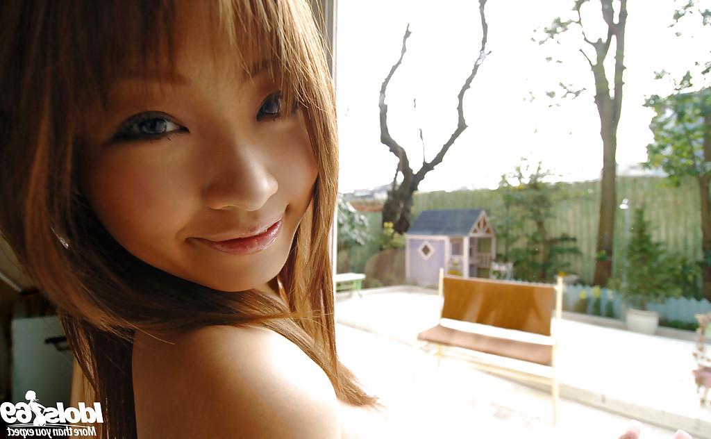 15P Foxy asian babe with sexy ass Reon Kosaka stripping off her clothes