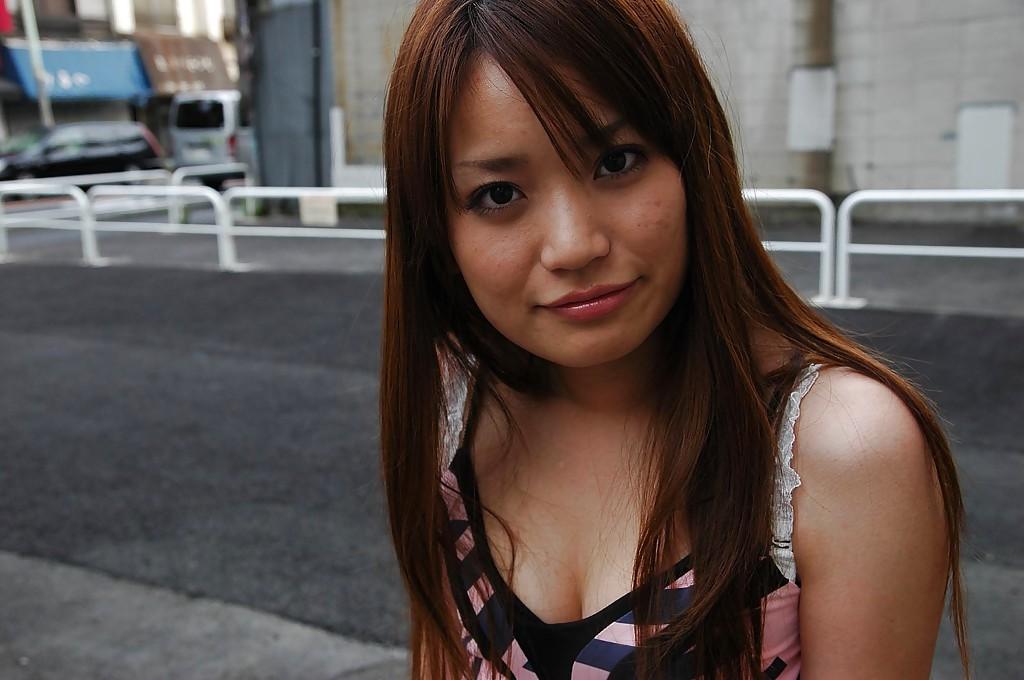 16P Smiley asian babe Saki Mitsui undressing and spreading her lower lips